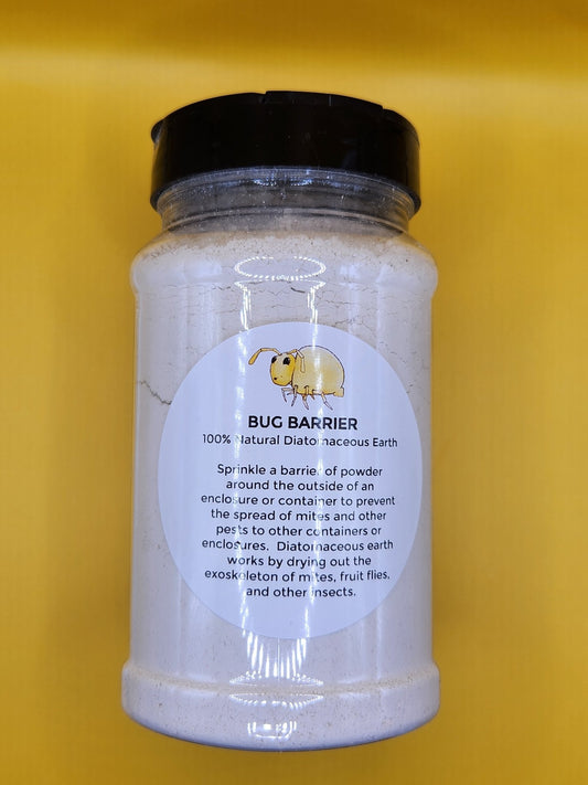 A clear plastic jar with a black lid holds white powder labeled Diatomaceous Earth Mite/Bug Barrier by I Heart Bugs. The label shows a yellow bug and yellow background. Made of 100% natural diatomaceous earth for isopod culture and mite prevention.