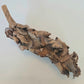 A brown, elongated cluster of dried, curled mushroom caps decorates the I Heart Bugs Palm Blossom Stalk, set against a white background. The stalk features rough, layered textures that highlight natural aging and decay.